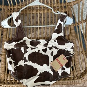 New with tags!! Brown and white cow print corset top.